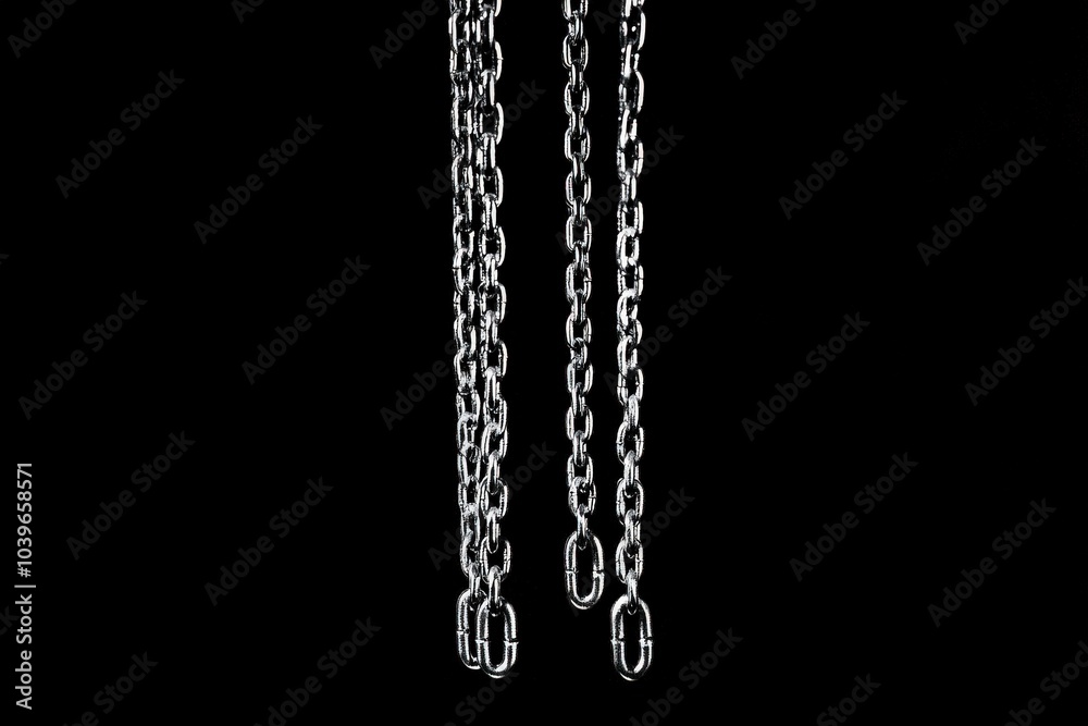 Hanging Chains on Black Background. Isolated Length of Chain Link Rising Up Hanging Chains on Black Background. Isolated Length of Chain Link Rising Up