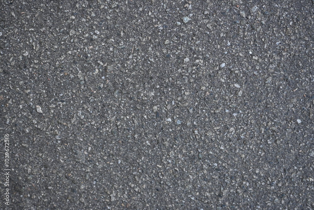cracks on grey asphalt, repair of old road surface as background, wet pavement texture, gray asphalt texture with red and white gravels
cracks on grey asphalt, repair of old road surface as background, wet pavement texture, gray asphalt texture with red and white gravels