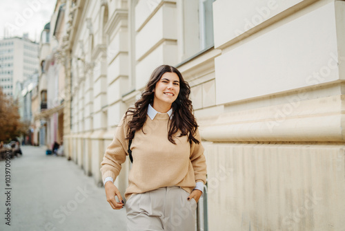 Young caucasian smiling woman student going to university 