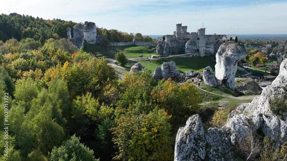 Aerial drone view of medieval castle Ogrodzieniec in Poland. Strongholds Eagles Nests in Polish Jurassic Highland in Silesia. Limestone rock castle ruins. Ogrodzieniec, Podzamcze castle in autumn. Aerial drone view of medieval castle Ogrodzieniec in Poland. Strongholds Eagles Nests in Polish Jurassic Highland in Silesia. Limestone rock castle ruins. Ogrodzieniec, Podzamcze castle in autumn.