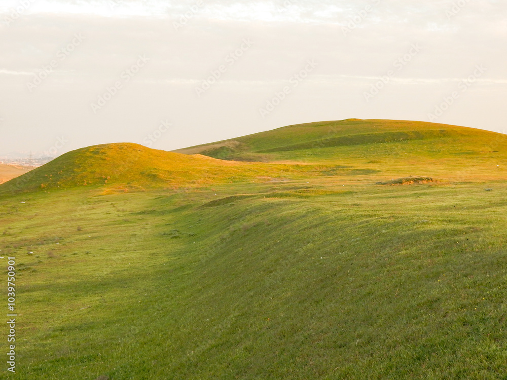 Rolling grassy hill of the Abscheron Peninsula in Baku, Azerbaijan Rolling grassy hill of the Abscheron Peninsula in Baku, Azerbaijan