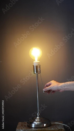the yellow light bulb table lamp is turned on and off with the switch button. Idea ball light
