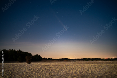 Comet C/2023 A3 Tsuchinshan-ATLAS visible in night sky after sunset in the Desert. photo