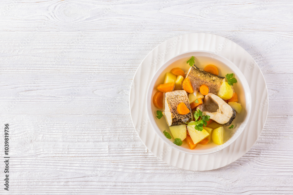 Clear Pike soup with veggies and spices, top view Clear Pike soup with veggies and spices, top view