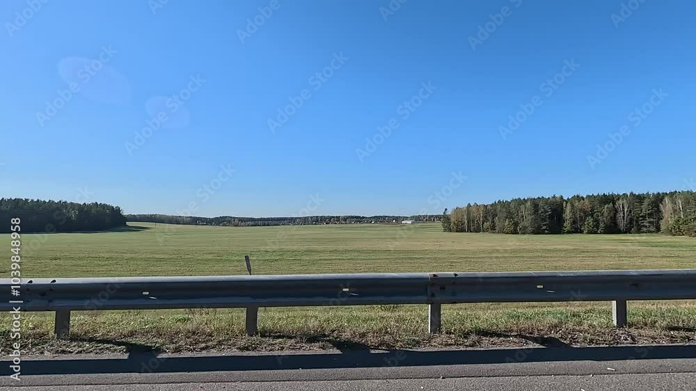 Autumn landscape, roadside view, road and landscape, forest and field, view from the car window Autumn landscape, roadside view, road and landscape, forest and field, view from the car window