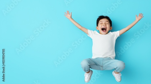 Asian boy jumping on flat background