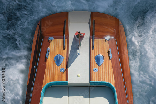 Wallpaper Mural Top view of the back of a luxury, varnished wooden boat for millionaires at sea, moving quickly through the water. The expensive wooden boat leaves a white wake behind as it moves. Torontodigital.ca