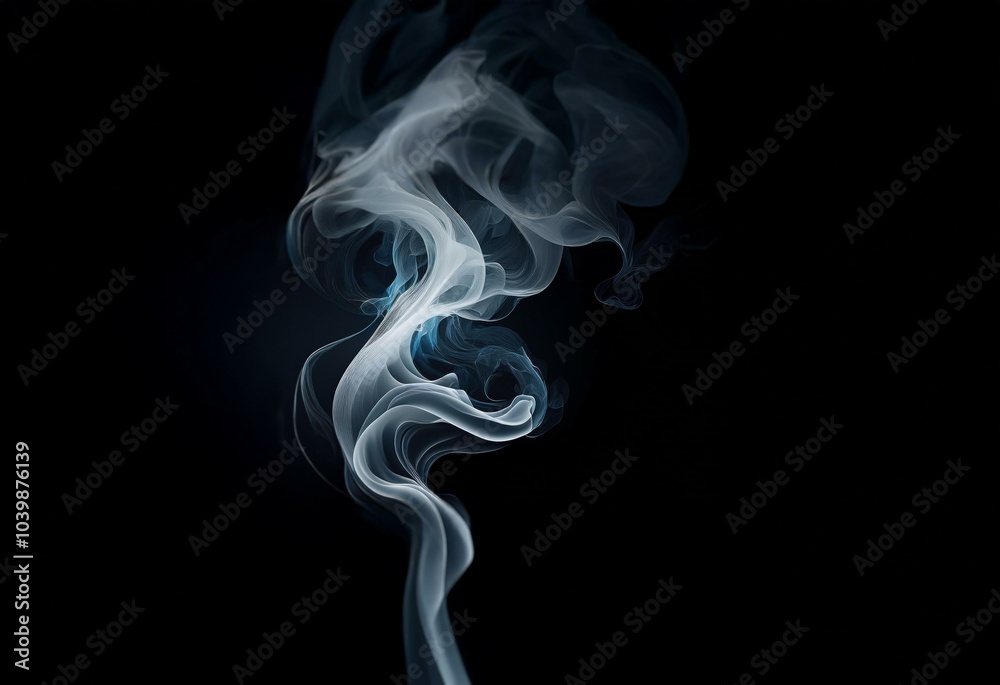White wispy smoke swirls on a black background. White wispy smoke swirls on a black background.