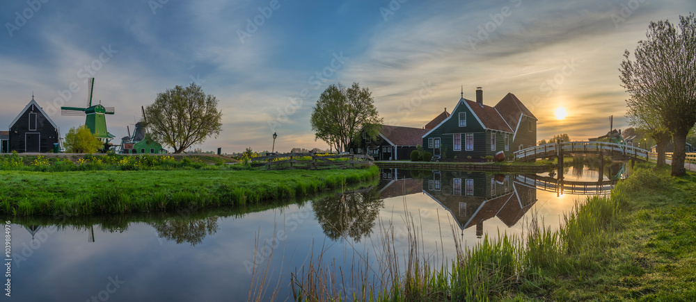 Dutch Windmill and traditional house panorama sunrise at Zaanse Schans Village, Amsterdam Netherlands Dutch Windmill and traditional house panorama sunrise at Zaanse Schans Village, Amsterdam Netherlands
