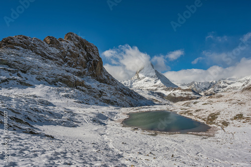 Zermatt Switzerland nature landscape at Matterhorn mountain peak and Riffelsee lake in winter season