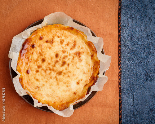 Cheesecake dessert for Thanksgiving. Copy space, flat lay. Basque dessert. Homemade baking. Fall recipe vibes . photo