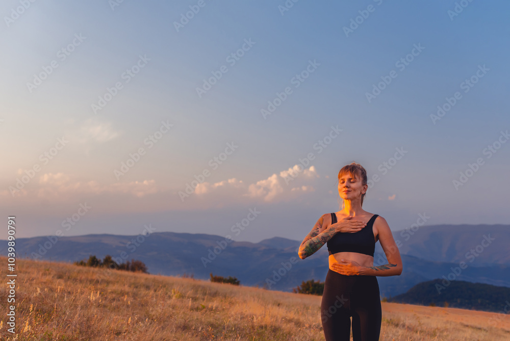 Woman Doing Breathing Exercises on Mountain Background