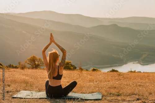 Obraz na płótnie Woman Practicing Yoga on Nature at Sunset w salonie