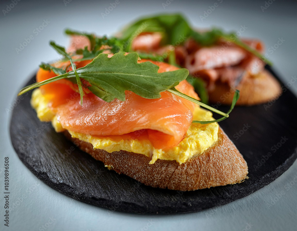 An exquisite sandwich featuring a fluffy omelette and smoked red fish, perfectly complemented by slices of salmon trout on a white background. An exquisite sandwich featuring a fluffy omelette and smoked red fish, perfectly complemented by slices of salmon trout on a white background.