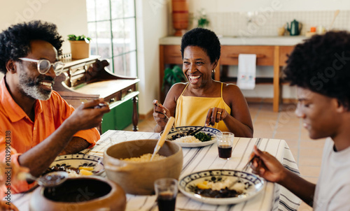 Happy Brazilian family dining for a traditional meal together at home