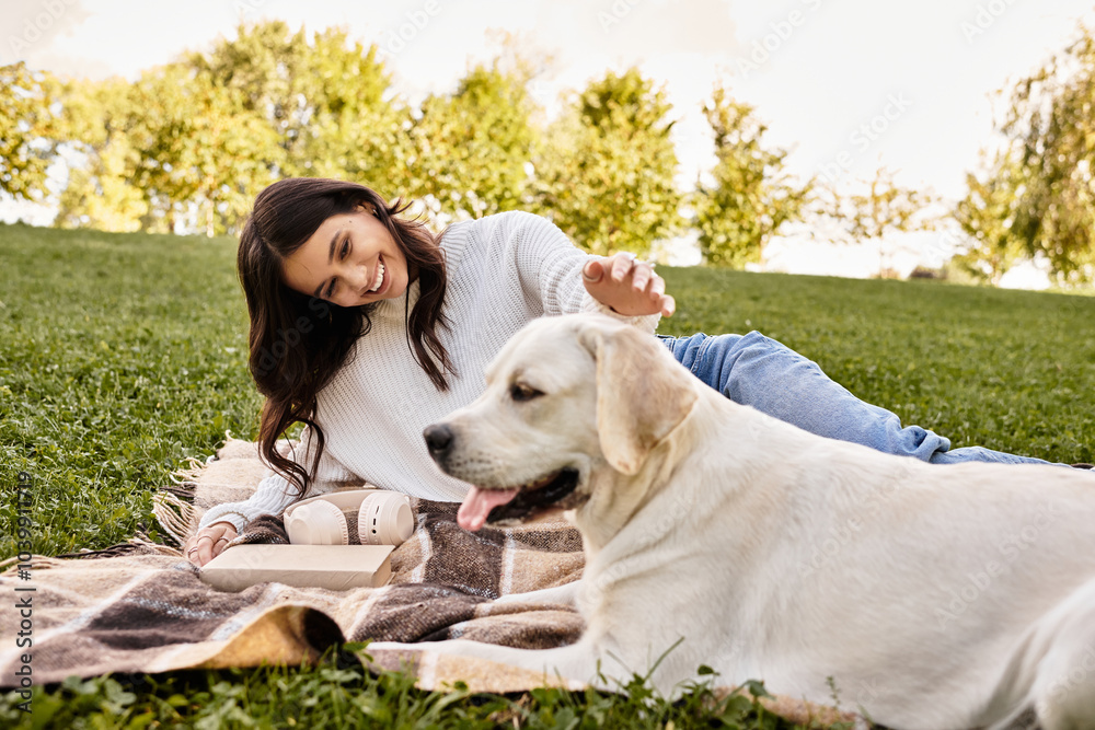 A joyful young woman relaxes outdoors, bonding with her dog on a warm autumn afternoon. A joyful young woman relaxes outdoors, bonding with her dog on a warm autumn afternoon.