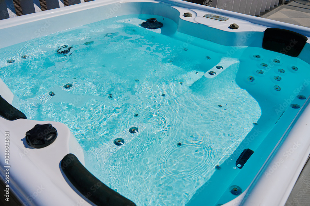 Close-up shot bubbling water in hot tub with headrests