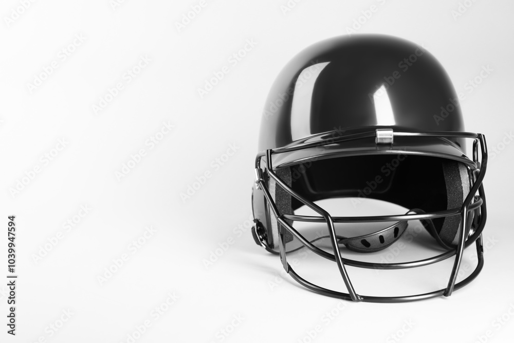 Fototapeta premium One black baseball helmet on white background, space for text