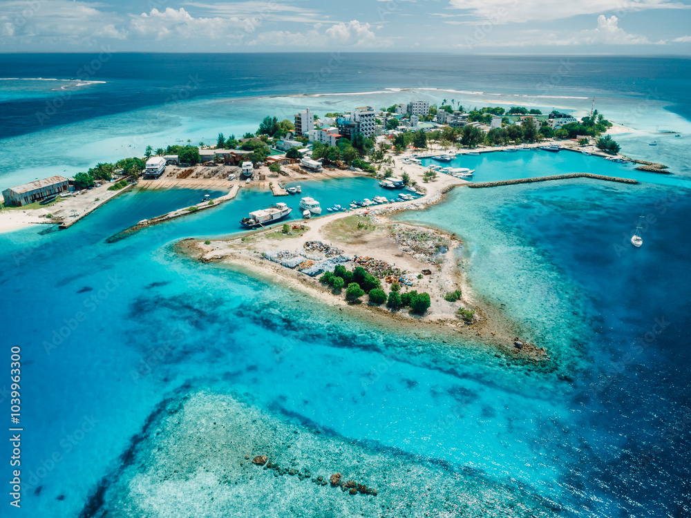 Gulhi island on Kaafu Atoll. Local island with blue sea on Maldives. Aerial View Gulhi island on Kaafu Atoll. Local island with blue sea on Maldives. Aerial View
