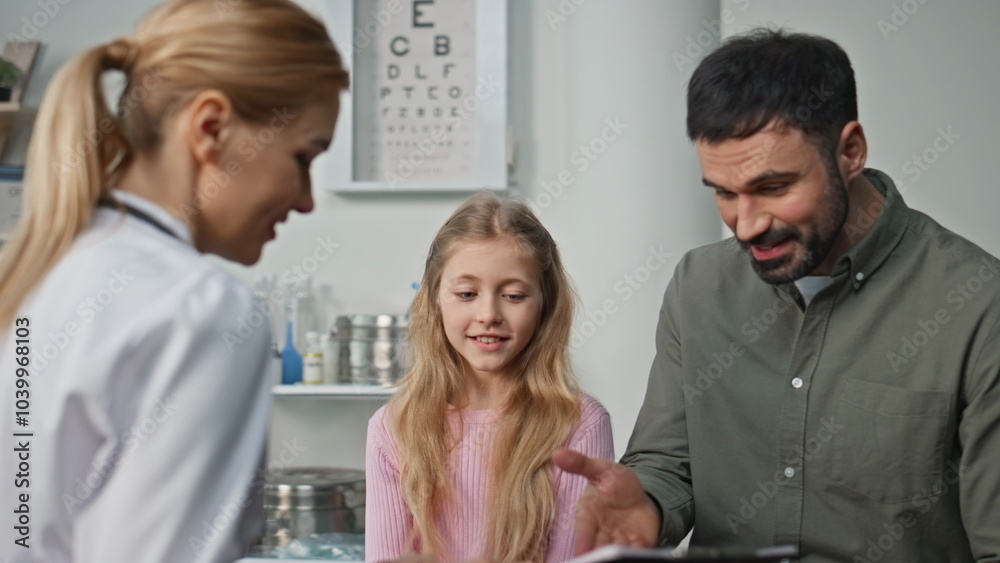 Smiling girl visiting therapist with father closeup. Happy doctor give high five Smiling girl visiting therapist with father closeup. Happy doctor give high five