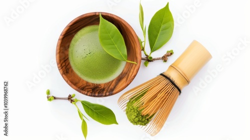 Bowl of green powder and a bamboo whisk