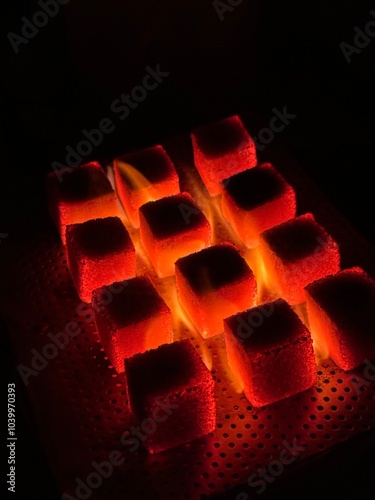 Fire burning from coconut charcoal briquette for business production