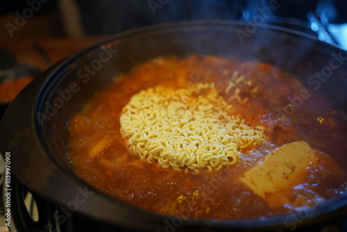 Add instant ramen to the kimchi stew broth and boil