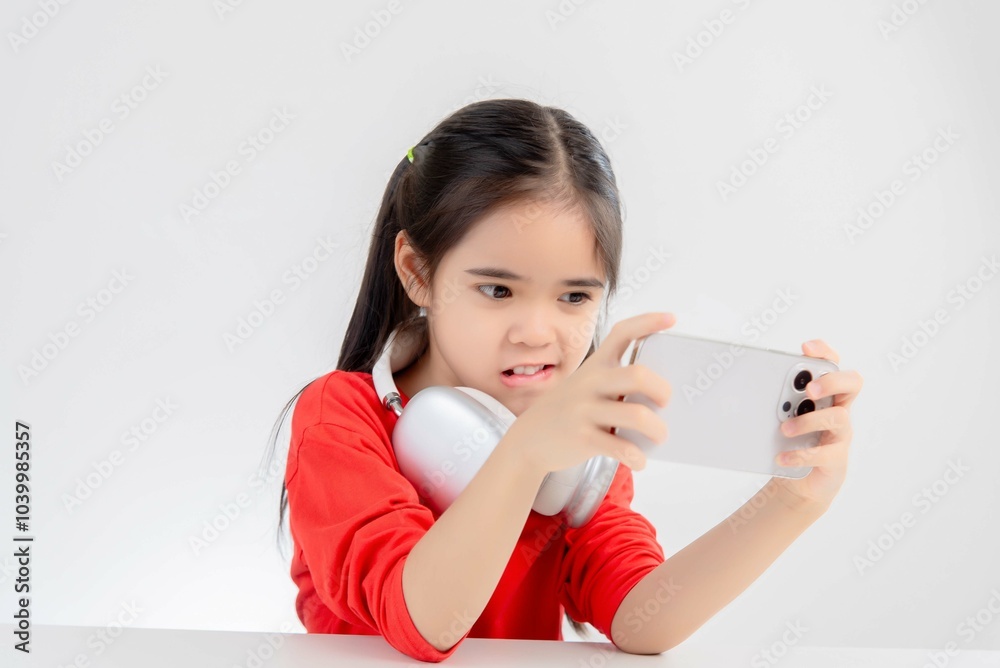 asia cute Girl playing game on a smartphone. asia cute Girl playing game on a smartphone.