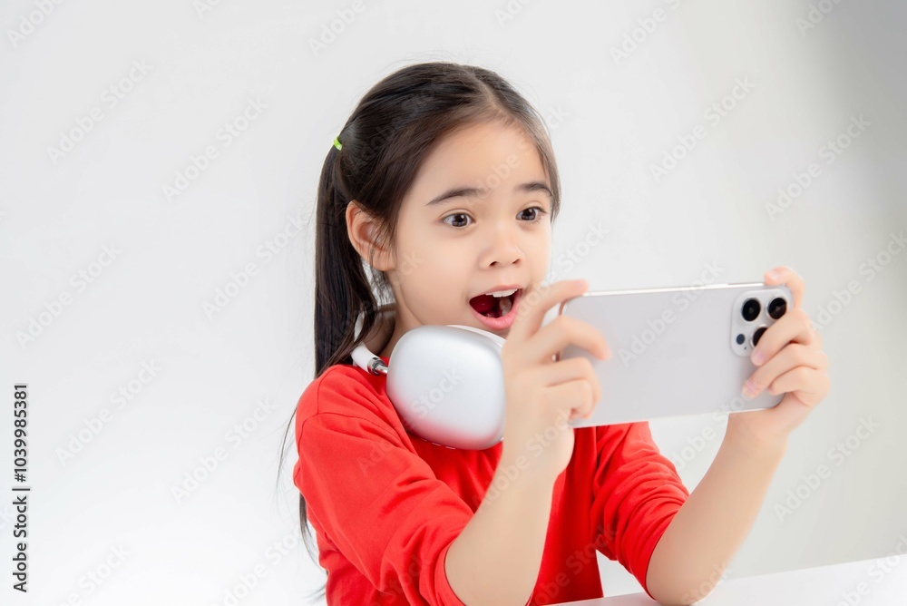 asia cute Girl playing game on a smartphone. asia cute Girl playing game on a smartphone.
