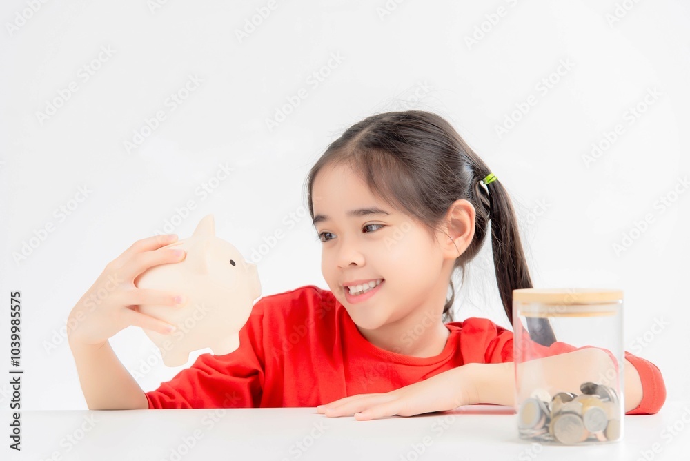 asia cute girl saving money bank or shaped money box asia cute girl saving money bank or shaped money box