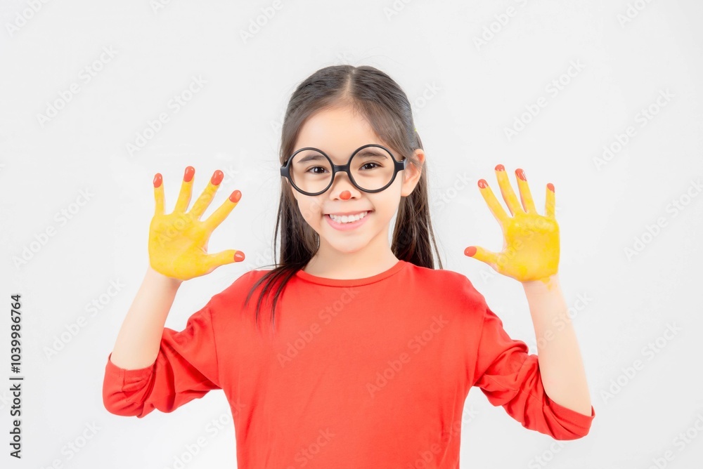 Little girl with hands painted in colorful paint. Little girl with hands painted in colorful paint.