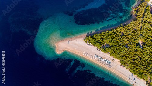 Glimmering turquoise waters and golden sands of Brac Island Croatia capture summer's essence photo