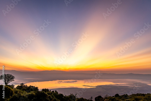 Photo of a beautiful sunrise from the rim of the Ngorongoro Crater in Tanzania, Africa