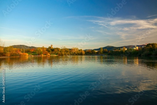 Autumn sunset over the lake. Freiburg im Breisgau Seepark, Black Forest, Germany