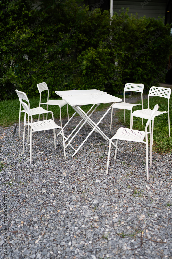 Set of white chair and table in garden patio home Set of white chair and table in garden patio home