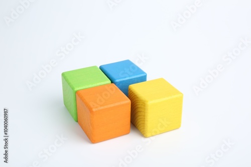 Many wooden colorful cubes on white background