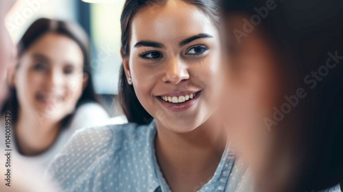 Young executive manager leads an engaging team meeting in a modern office, radiating positivity and teamwork among coworkers during a bright morning