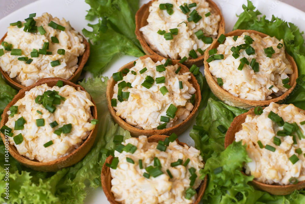 Egg paste cupcake. Egg spread tartlets. Boiles eggs with mayo on baked tarta cake sprinkled with chives onion spring. Salty party snack. Eggs salad on tartlet. Egg paste cupcake. Egg spread tartlets. Boiles eggs with mayo on baked tarta cake sprinkled with chives onion spring. Salty party snack. Eggs salad on tartlet.
