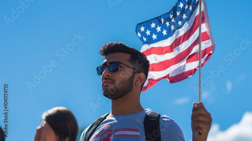 International democratic transition event with a man holding the American flag photo