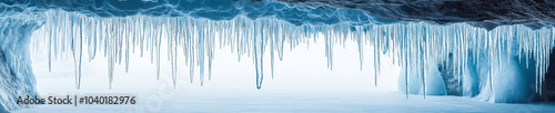 An Inside view of Ice cave with icicles in winter.