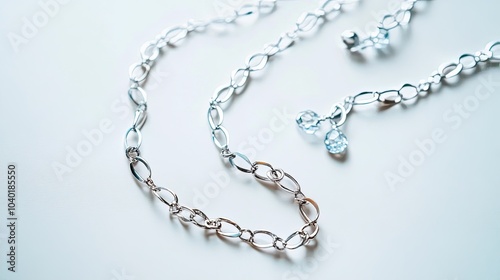 Wallpaper Mural Delicate Silver Necklace on Clean White Surface Torontodigital.ca