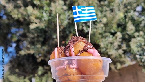 sweet loukouma or loukoumades greek flag street food sweet photo