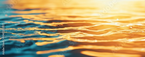 Blue and gold water ripples with reflections at sunset