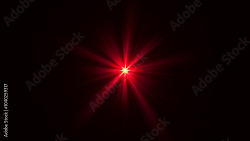 Bright red starburst light with glowing fiery rays in dark space