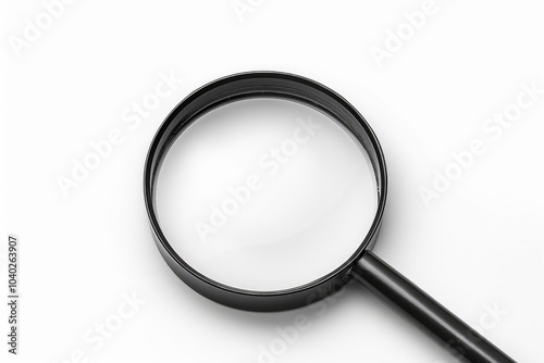 A close-up shot of a magnifying glass on a white surface, perfect for illustrating examination or investigation scenes