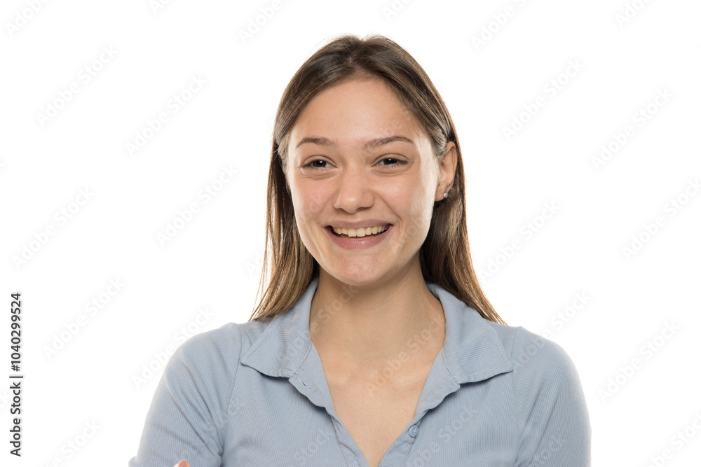 Portrait of a beautiful young happy woman without makeup on a white studio background Portrait of a beautiful young happy woman without makeup on a white studio background