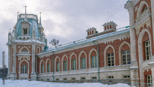 Tsaritsyno is a palace and park ensemble in the south of Moscow, founded by order of Empress Catherine II in 1776. An ancient palace in the winter cold. Snow drifts in front of the palace.