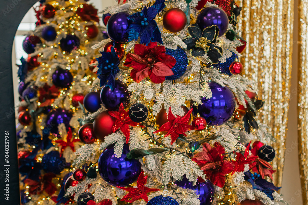 A Christmas tree decorated with balloons, garlands and tinsel stands in a bright room. preparing for the holiday. festive atmosphere A Christmas tree decorated with balloons, garlands and tinsel stands in a bright room. preparing for the holiday. festive atmosphere