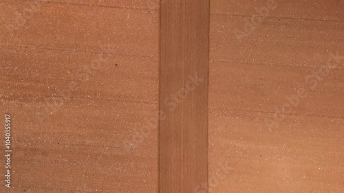 Drone Footage of Arid Farmland with Symmetrical Rows and Textured Soil, for Backgrounds and Open Space for Copy. Big vertical line