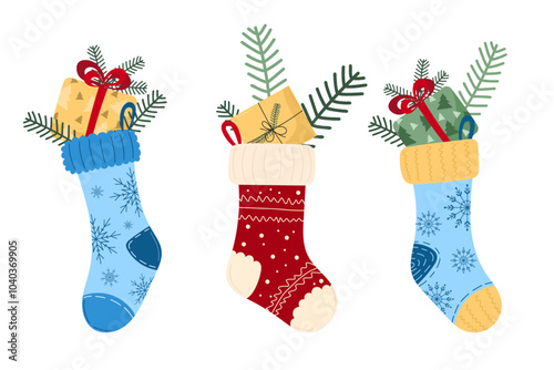 Christmas charming illustration of three festive stockings filled with gifts, pine branches on white background. Cute vector symbols of warm family Christmas evenings. For holiday decor, cards, poster